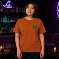 Female model wearing the Autumn Bubble Bubble unisex graphic T-shirt with Naughty Flamingo left-chest design