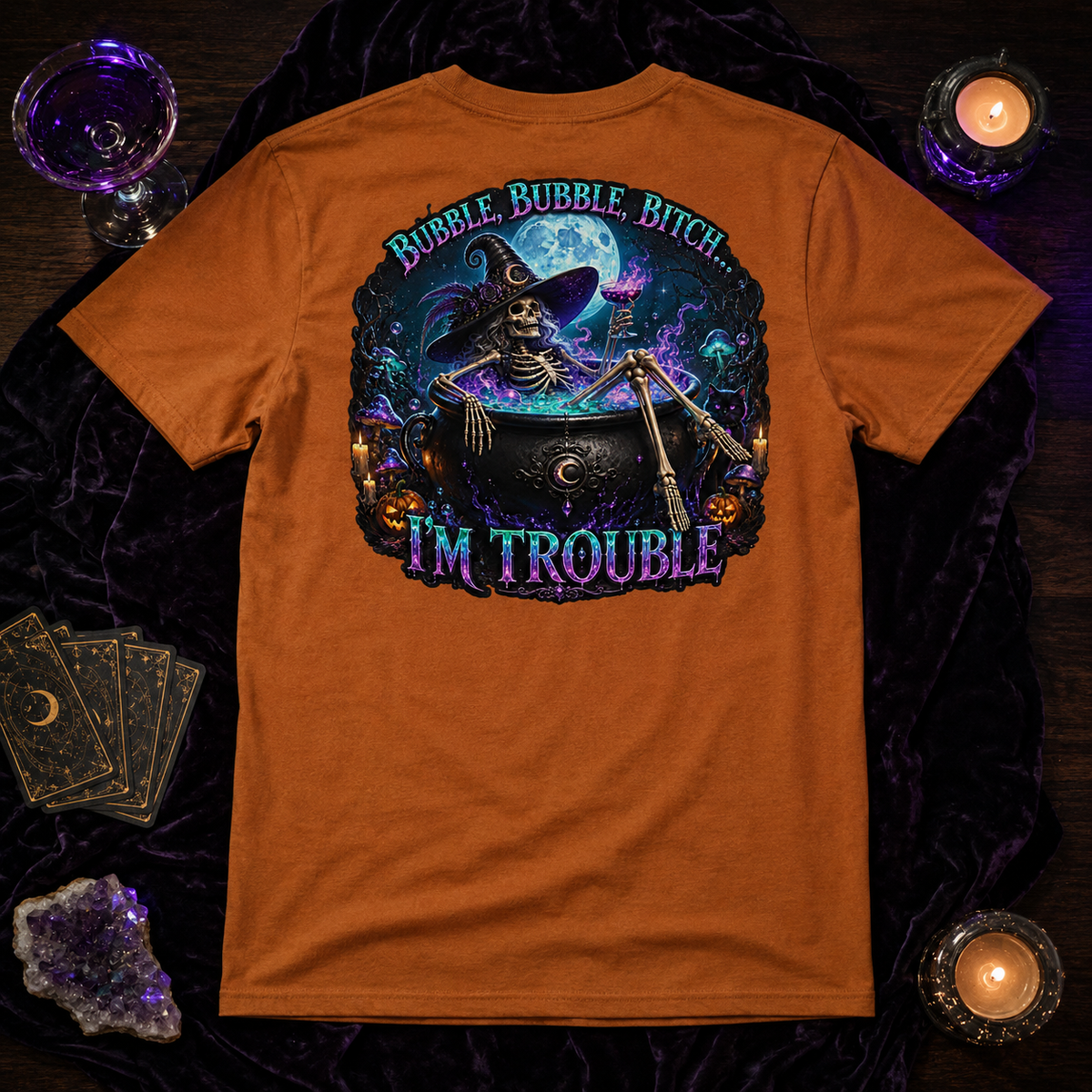 Staged tabletop view of the Autumn Bubble Bubble unisex graphic T-shirt back design