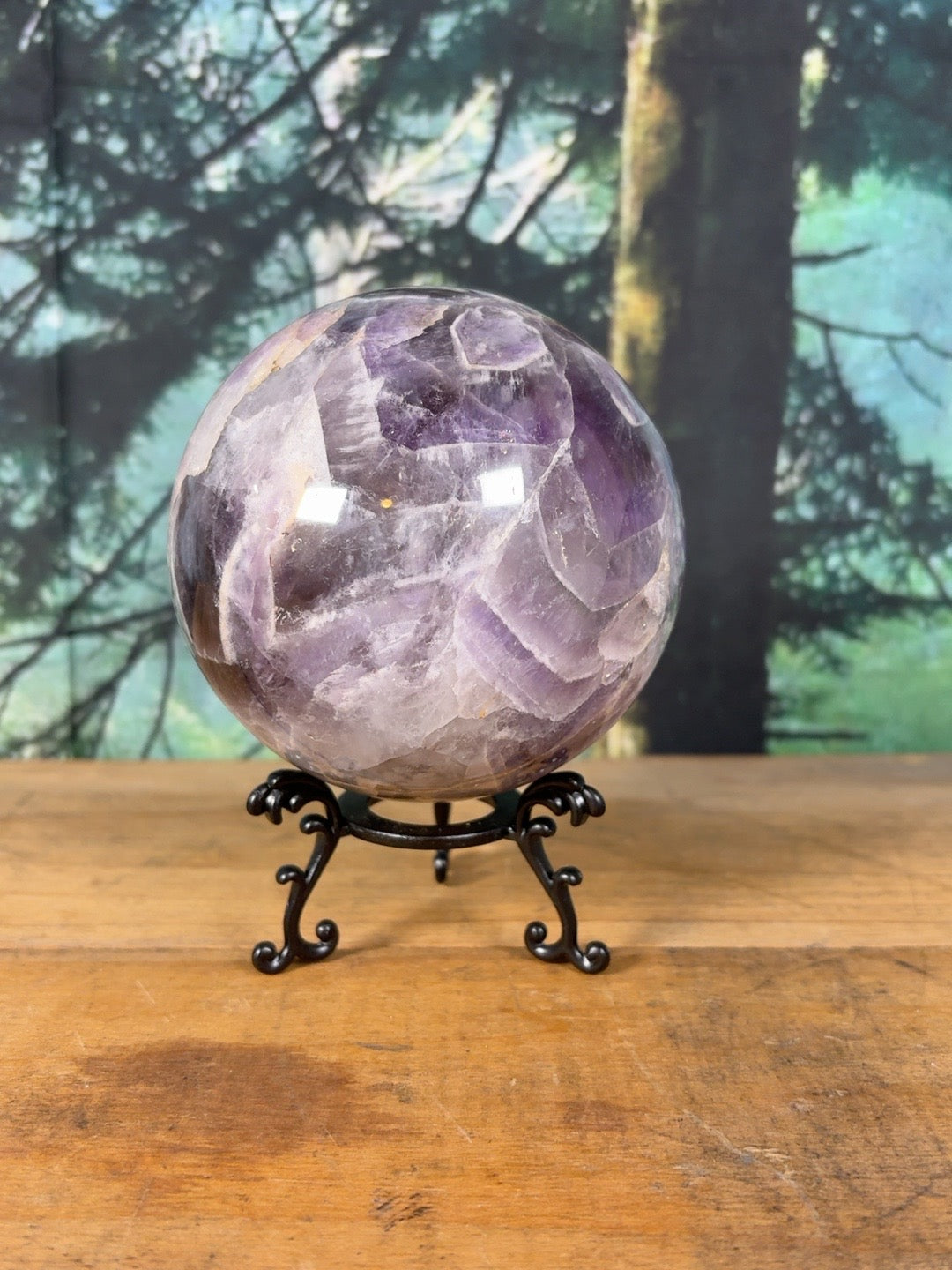 Large chevron amethyst sphere showing purple and white quartz banding – view 2