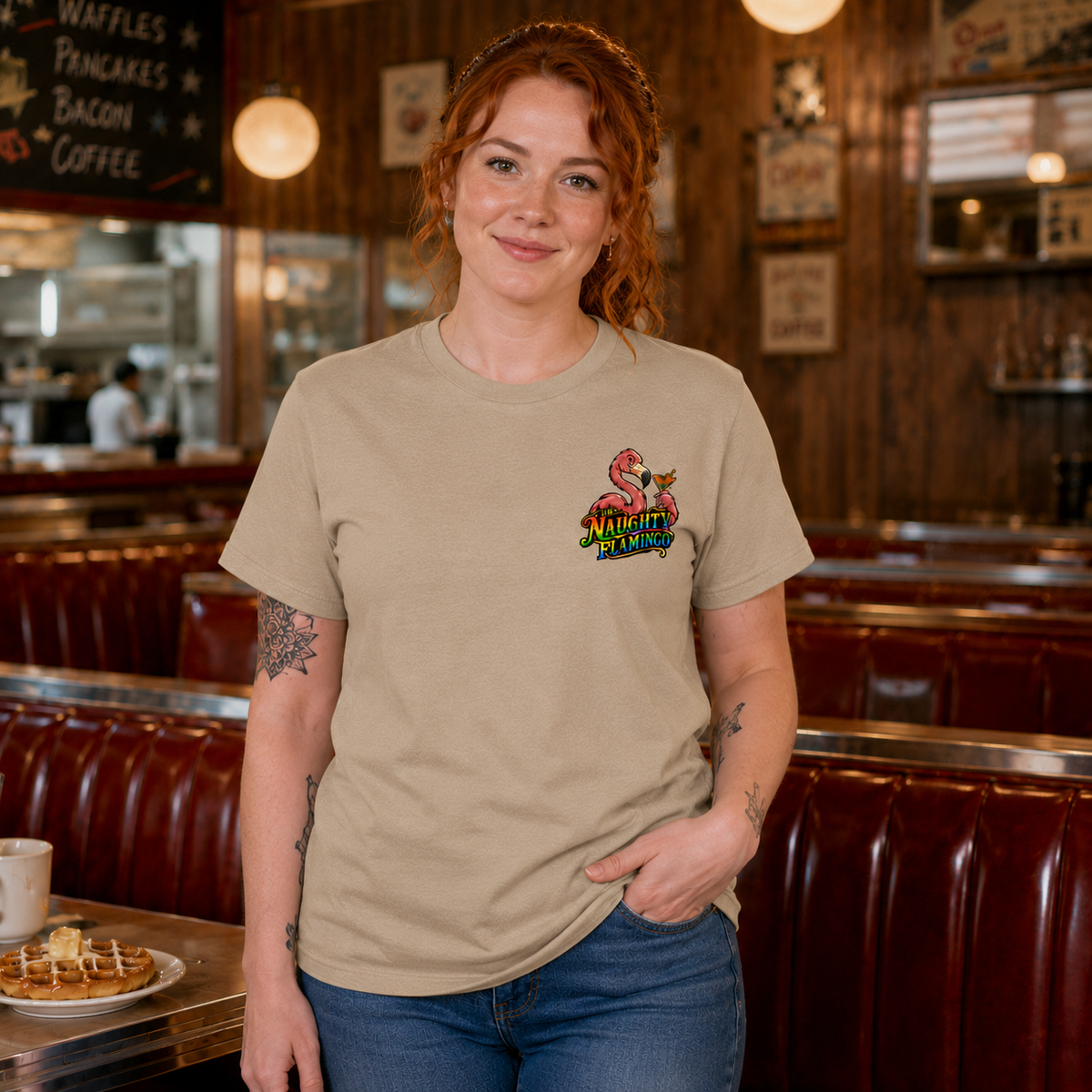 Woman modeling the Tan T-shirt front with small Naughty Flamingo left-chest logo