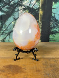 Large Carnelian Agate egg with orange and white translucent banding, front view