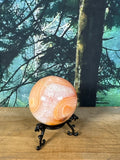 Peach banded Carnelian Agate druzy sphere front view