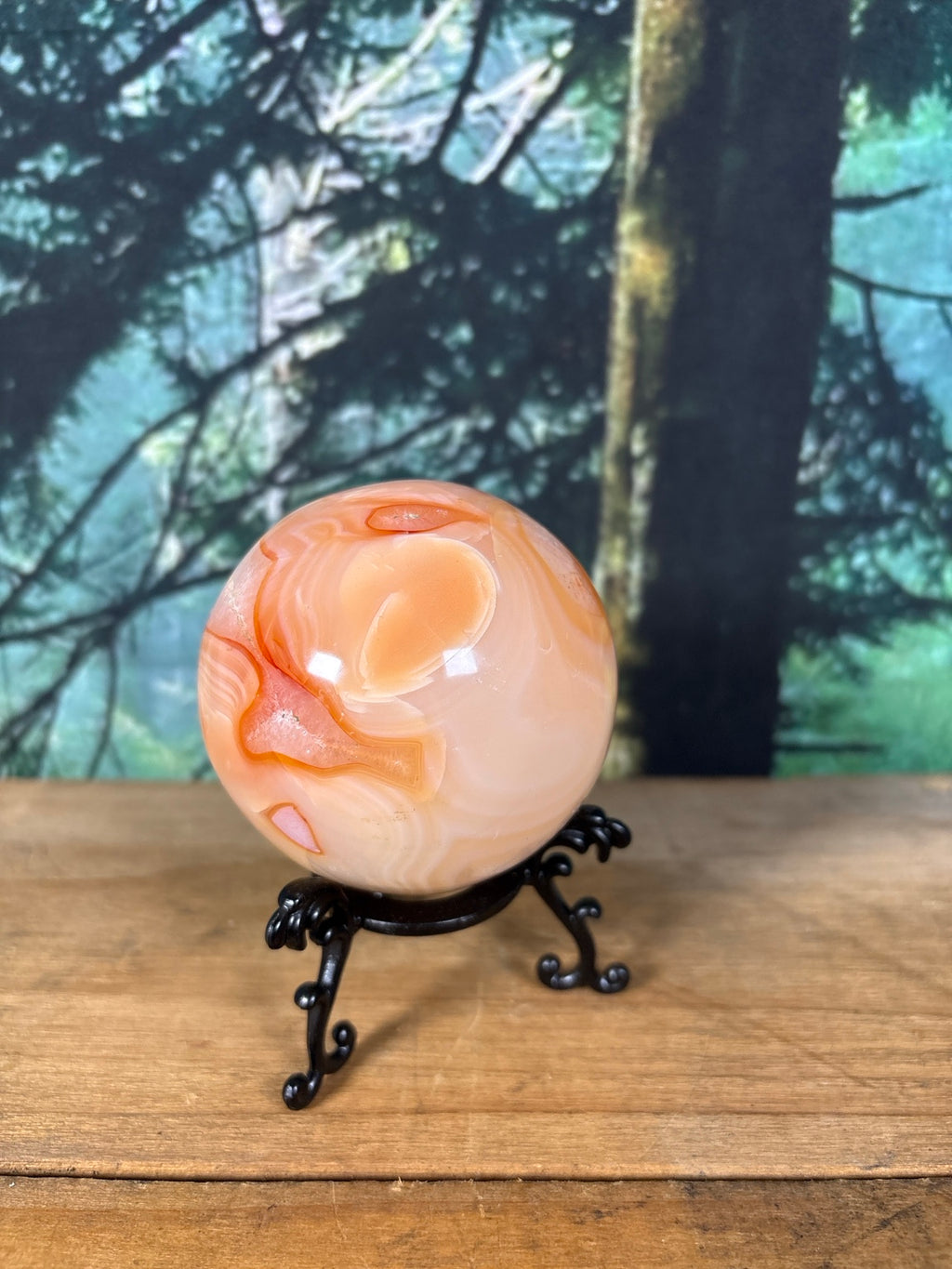 Carnelian Agate sphere showing peach and orange banding
