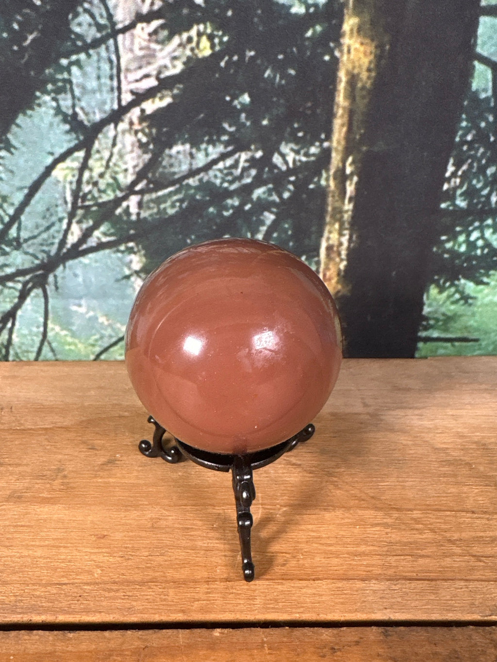 Brown banded Calcite sphere polished side view
