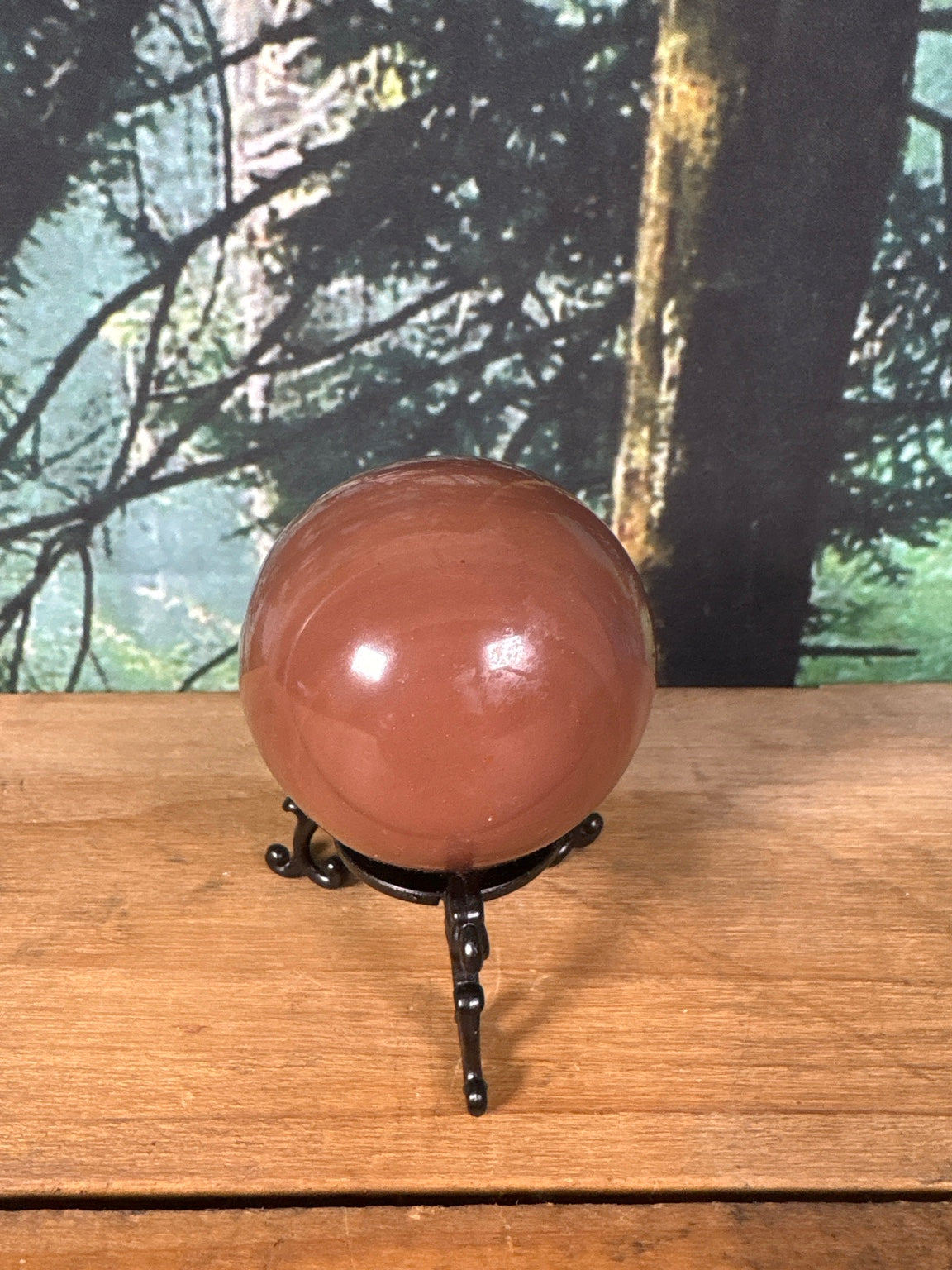 Brown banded Calcite sphere polished side view