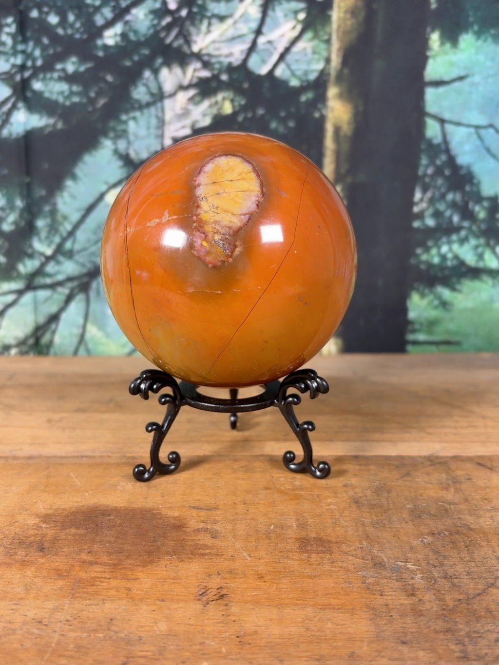 Large orange Polychrome Jasper sphere with yellow orbicular feature, front view