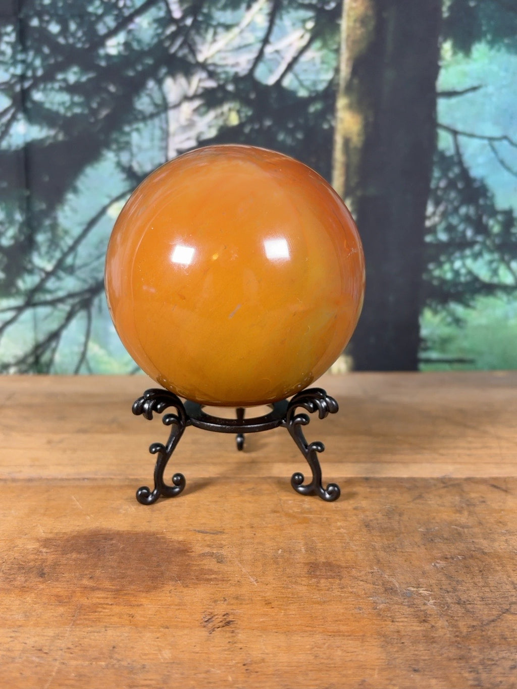 Large Polychrome Jasper sphere showing smooth golden orange coloring