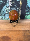 Red Creek Jasper sphere with red gold and olive landscape banding