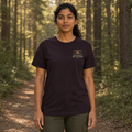 Female model wearing the Oxblood Black Henry’s Crystal Lake Camp Bella Canvas T-shirt, front view