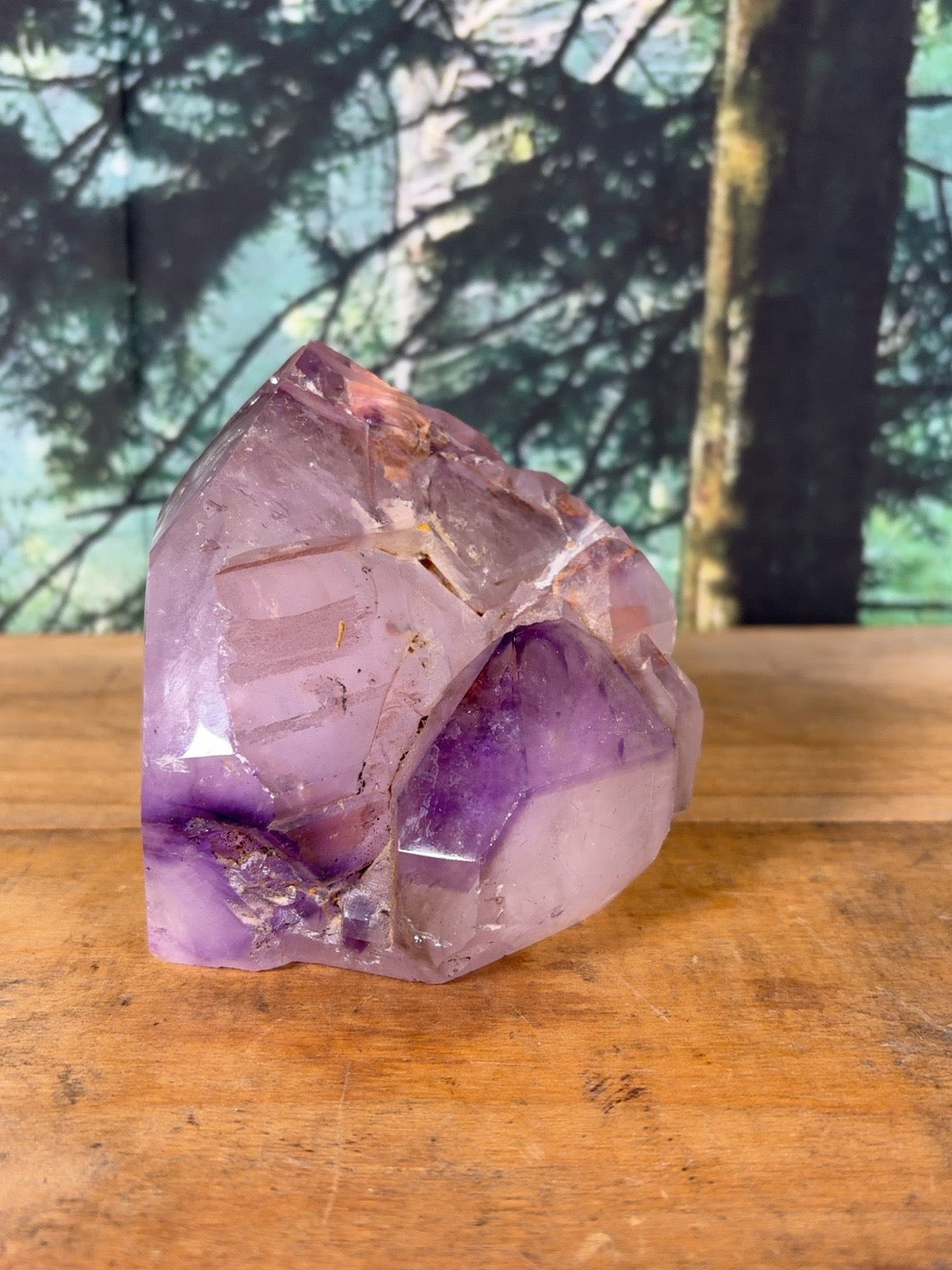 Amethyst cluster showing deep purple points and iron inclusions – view 3