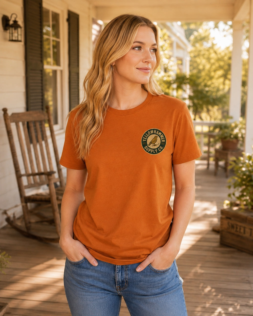Front view of Yellowhammer Supply Co. Autumn T-shirt with left chest Yellowhammer logo on female model